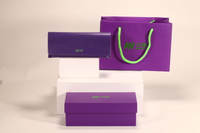 A violet style glasses case set, which includes cardboard box, glasses case, shopping bag, color and LOGO can be customized to create your own glasses case
