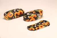 An eyeglass case set consisting of an eyeglass case and a leather case printed with chrysanthemums and sunflowers