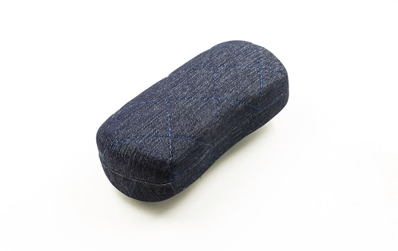 2021 Glasses case A dark blue glasses case with lines printed on it